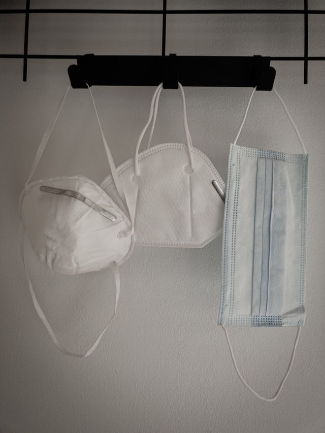 facemasks hanging on a wall